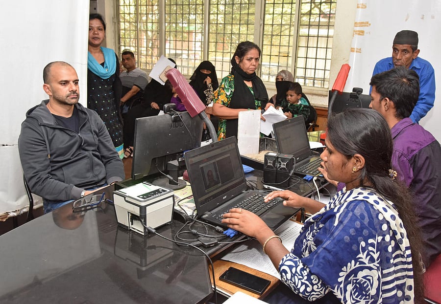 People at Aadhaar center in Bengaluru. Photo by S K Dinesh