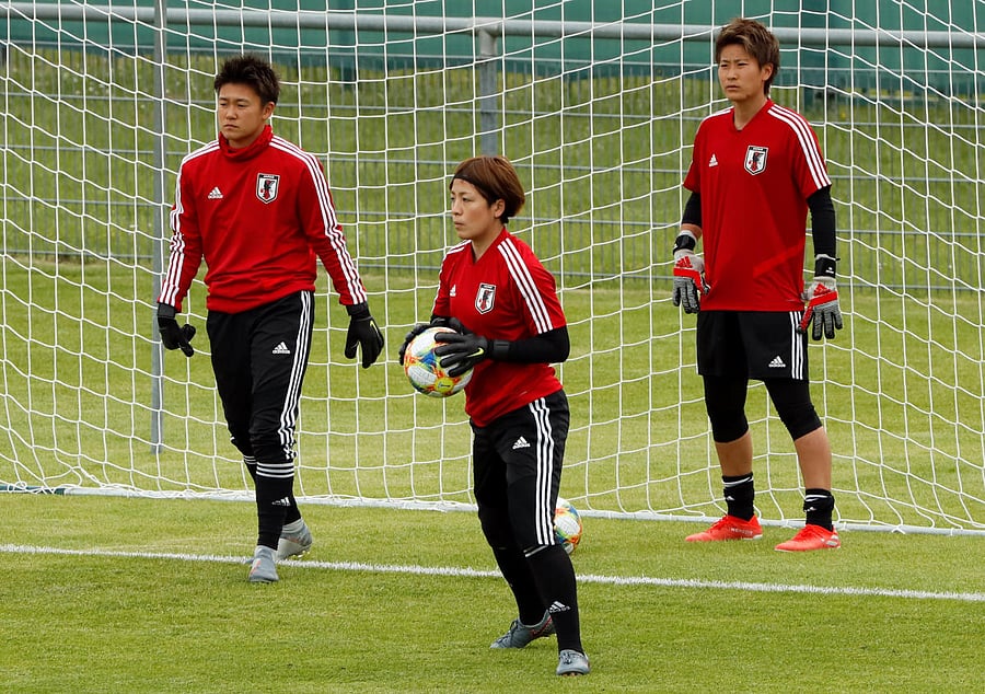 Japan's Sakiko Ikeda, Ayaka Yamashita and Chika Hirao during training. REUTERS