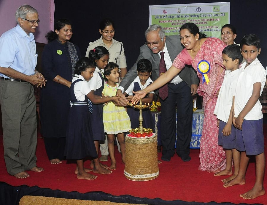 District and Sessions Judge C M Joshi and Additional Deputy Commissioner Vidya Kumari along with children inaugurate a programme organised on the occasion of World Day Against Child Labour in Udupi on Wednesday.