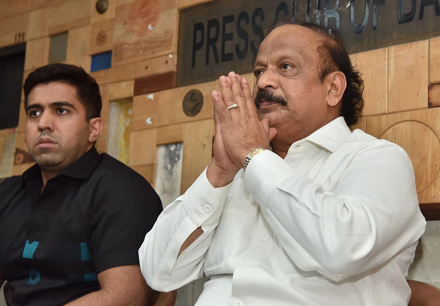 Shivajinagar MLA, R Roshan Baig, and his son R Ruman Baig at a press conference on Wednesday. DH PHOTO/JANARDHAN B K