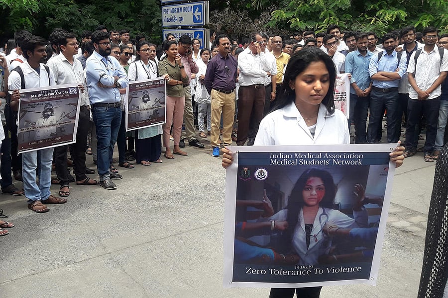 Doctors of Surat Medical association during a protest to show solidarity with their counterparts in West Bengal, who stopped work on Tuesday protesting against the assault on their colleagues, in Surat on Friday. PTI photo