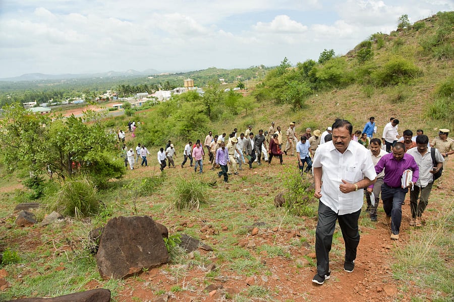 The Government Assurance Committee of the State Legislative Assembly Chairman A T Ramaswamy is seen during the inspection of the Survey No. 137 to inquire into the alleged irregularities at B M Kaval in Kengeri Hobli on Friday. DH Photo/ B H Shivakumar
