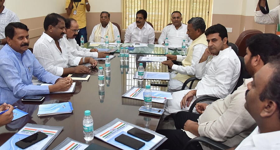 AICC general secretary and Karnataka Incharge K C Venugopal chairs a meeting at the KPCC office in Bengaluru on Wednesday. CLP leader Siddaramaiah, KPCC president Dinesh Gundurao, defeated Congress candidates B N Chandrappa, Dhruvanarayan, M Veerappa Moil