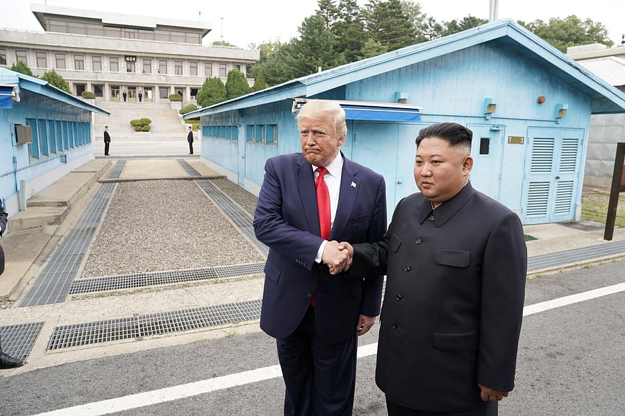 U.S. President Donald Trump meets with North Korean leader Kim Jong Un at the demilitarized zone separating the two Koreas, in Panmunjom, South Korea, June 30, 2019. (Photo by REUTERS)