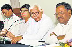 brain-storming: Chairman of the Third State Finance Commission Implementation Task Force, A G Kodgi, member of the task force Thimmegowda, CEO of Zilla Panchayat Ajay Nagabushan at a meeting held in zilla panchayat premises, here on Tuesday. DH Photo