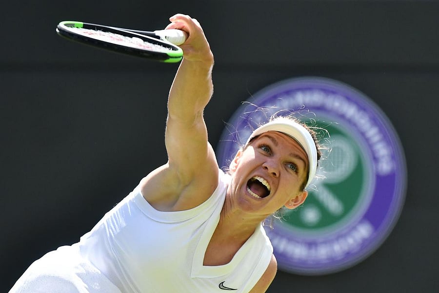GUTSY: Romania's Simona Halep serves during her win over Belarus's Aliaksandra Sasnovich. AFP