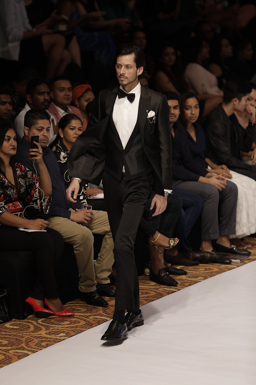 Runway models must have a relaxed walk, almost like they are walking down the street but in style