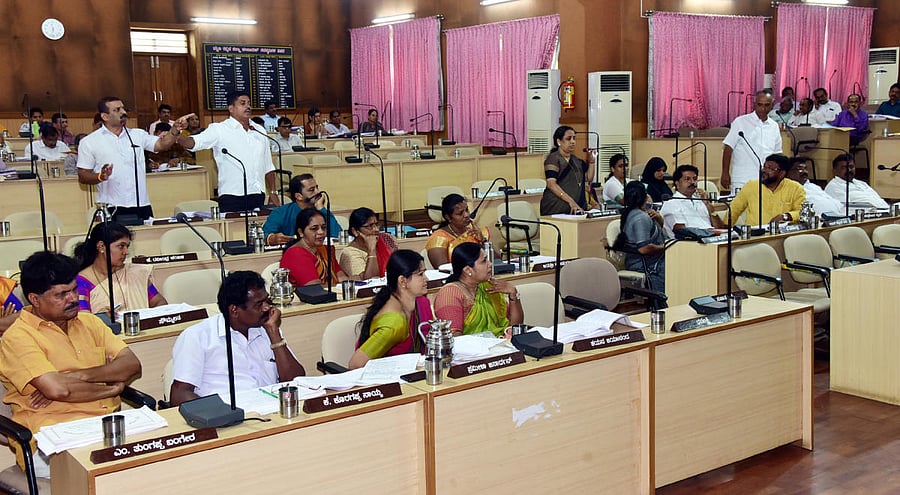 Members of Zilla Panchayat exchange words during the ZP meeting held in Mangaluru on Tuesday.