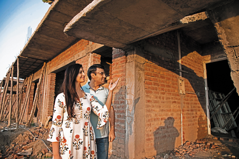 Couple in their renovating apartment; Picture credit: Getty Images