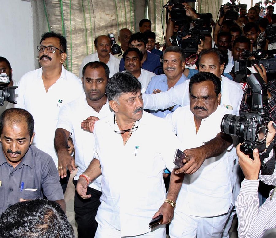 Minister D K Shivakumar arrives at Vidhana Soudha to convince the rebel Congress MLAs, in Bengaluru on Saturday.