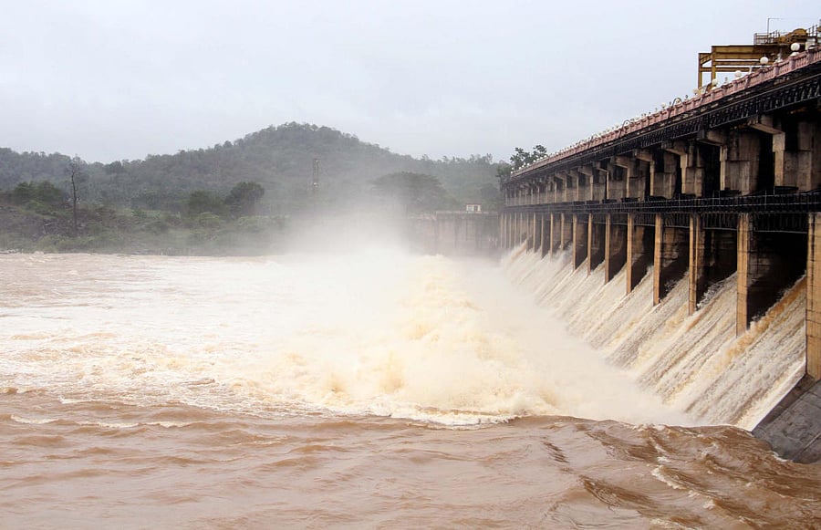 A total of 17,200 cusecs of water was released from 13 crest gates of Tunga dam, at Gajanur in Shivamogga district on Wednesday, after the reservoir reached its maximum level of 588.24 metre. DH PHOTO