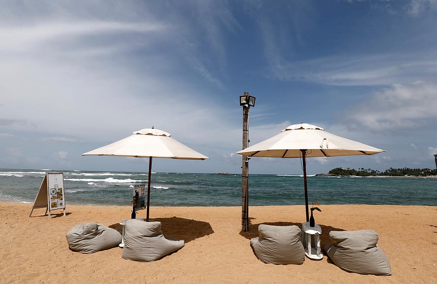 An empty beach is seen in front of the Pearl Divers, a diving school, at Unawatuna beach in Galle, Sri Lanka. (Reuters Photo)