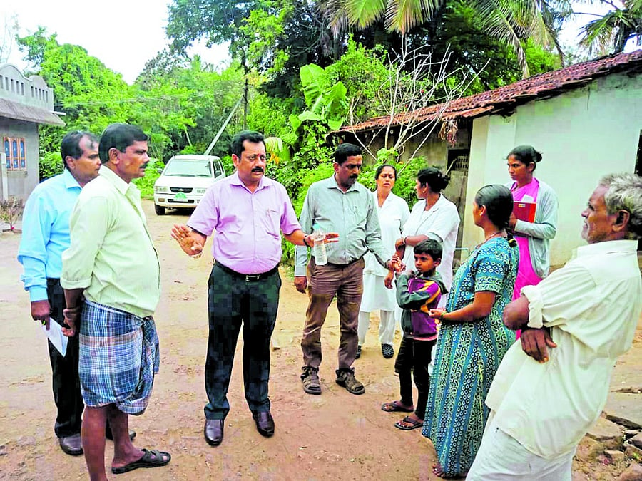 District Health Officer Dr K Mohan visited the houses in Thorenuru village on Wednesday, in the wake of the outbreak of viral fever in the village.