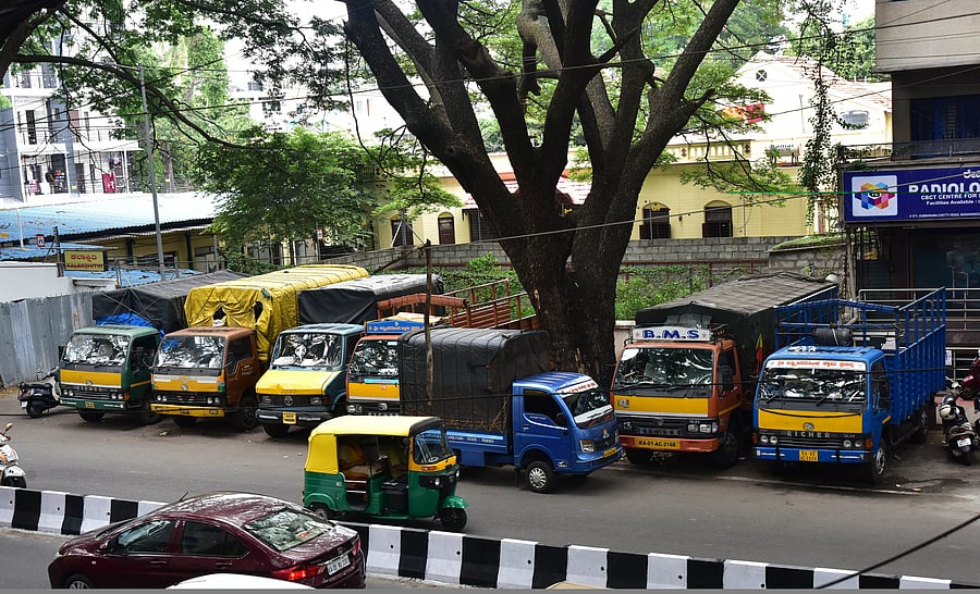 Subbarama Chetty Road, near Nettakallappa Circle, is taken up by goods trucks and autos. PHOTOS BY IRSHAD MAHAMMAD