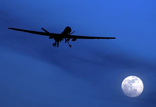 FILE - In this Jan. 31, 2010 file photo, an unmanned U.S. Predator drone flies over Kandahar Air Field, southern Afghanistan, on a moon-lit night. AP photo