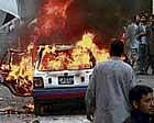 A vehicle is on fire after a bomb blast struck a Shiite Muslim procession in Karachi on Monday. AP