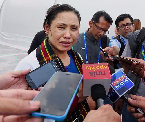 Boxer L Sarita Devi today got support from Sports Minister Sarbananda Sonowal and Olympic bronze medallist pugilist Vijender Singh, who said that world body AIBA should take a lenient decision on her for refusing to accept her Asian Games medal after a controversial defeat. PTI file photo