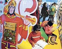 Children read books at a stall at the World Book Fair 2010 in New Delhi on Saturday. The 19th New Delhi World Book Fair is open till February 7. AFP