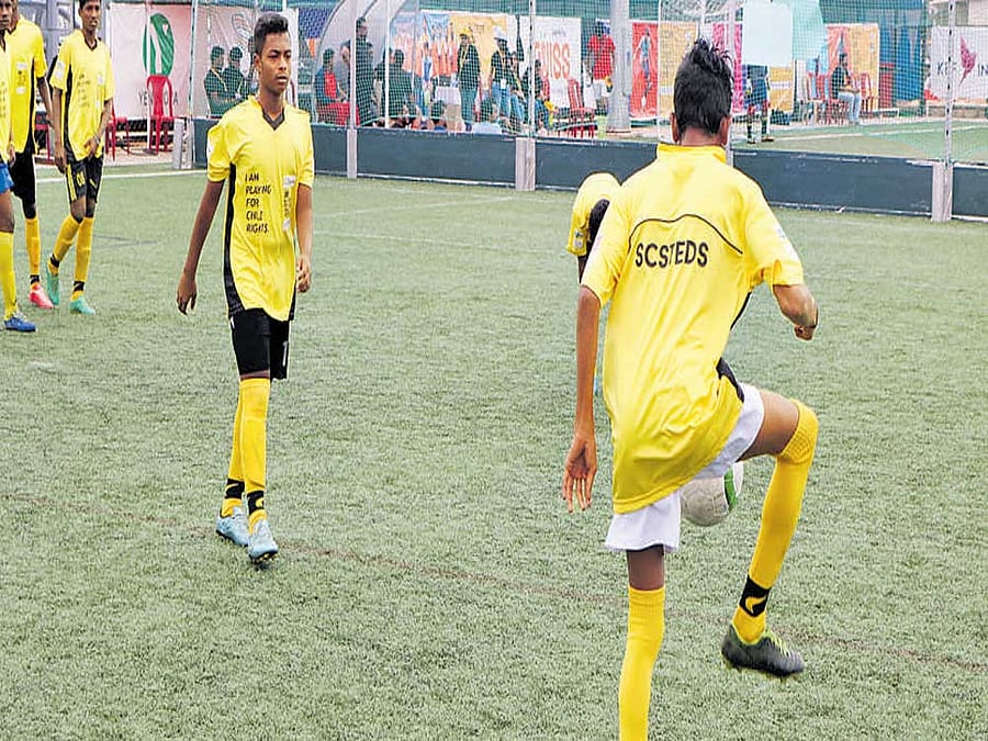 The team from Slum Children Sports Talent Education Development Society in action at 'Soccer for Child Rights' on Saturday.