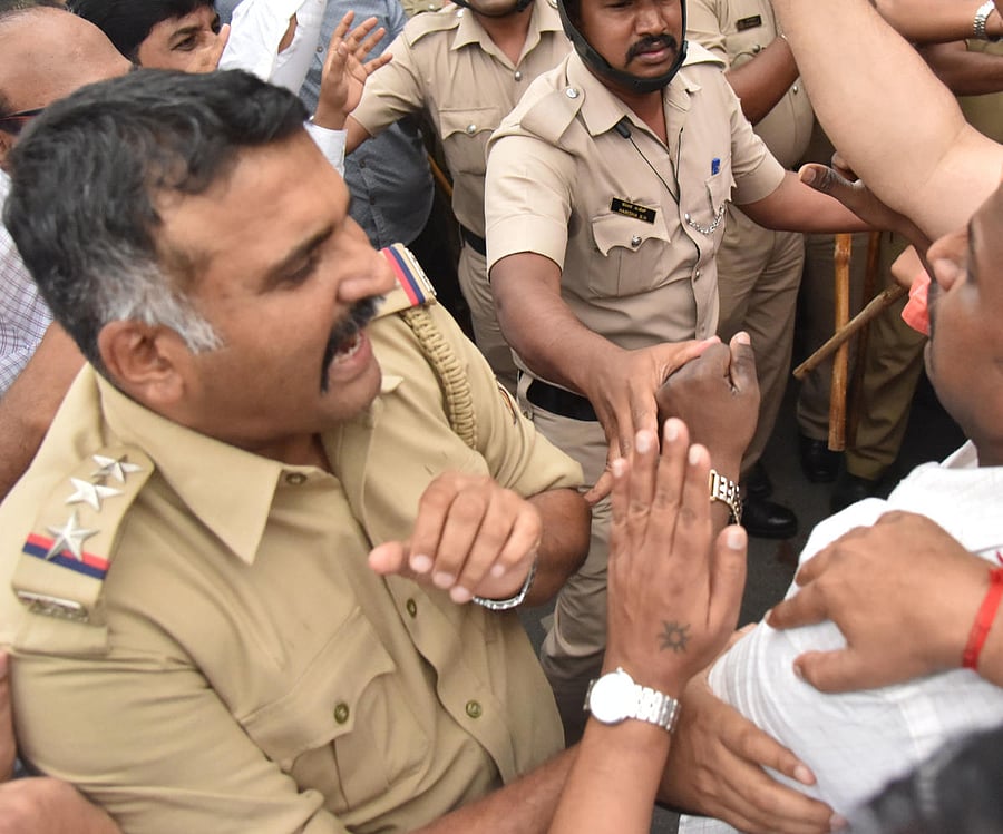 High Grounds Police Inspector E I Sirajuddin during the scuffle on Race Course Road on Tuesday.