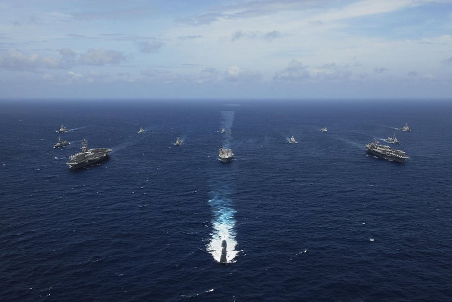 Naval ships from India, Australia, Japan, Singapore, and the United States steam in formation in the Bay of Bengal during Exercise Malabar 07-2. US Navy photo/Stephen Rowe