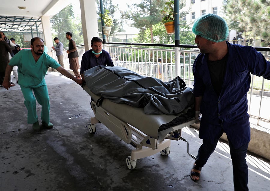 Emergency workers transport the dead body of a victim to the hospital after a blast in Kabul, Afghanistan July 25, 2019. (REUTERS)