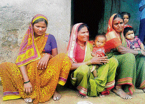 bravo! Yellamma with her family members at her native Gollapalleradoddi village, after her adventurous feat. DH PHOTO