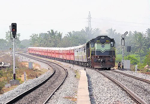 A baby boy delivered inside a toilet of a train by a woman slipped through the flush pipe and fell on railway track but survived miraculously.DH File Photo for representation purpose only