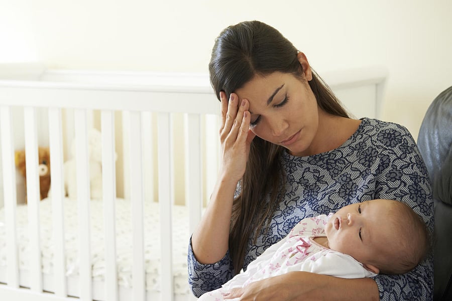 Tired Mother Suffering From Post Natal Depression