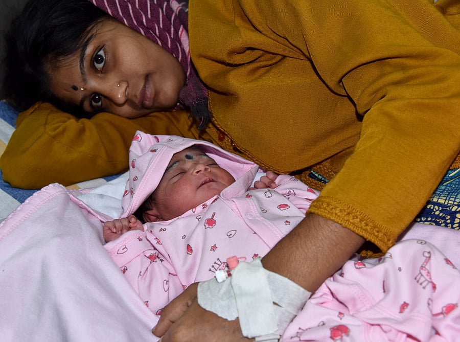 Shashikala with her baby born on the first day of the New Year at a BBMP maternity hospital in Rajajinagar. (DH Photo/B H Shivakumar)