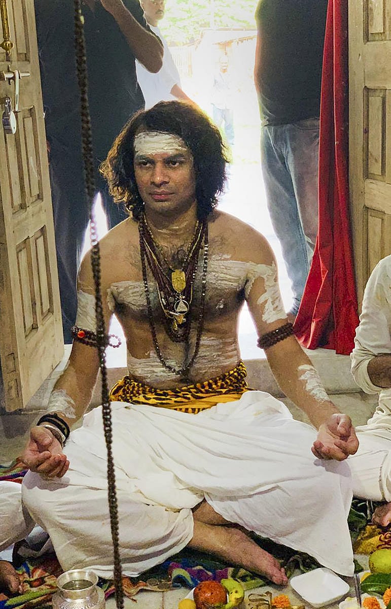 RJD chief Lalu Prasad's elder son Tej Pratap Yadav, dressed as Lord Shiva, is seen offering prayers (PTI File Photo)