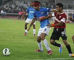 Actor Ranbir Kapoor (8) and cricketer ManoJ Tiwari (10) vie for the ball during a celebrity football match organised by Virat Kohli charity foundation All heart football club at JLN stadium in New Delhi on Saturday. PTI Photo
