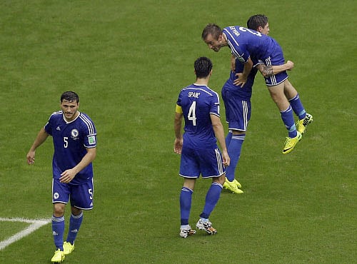Bosnia defender Avdija Vrsajevic, right, celebrates his goal with his teammates during the second half of a group F World Cup soccer match Iran at the Arena Fonte Nova in Salvador, Brazil, Wednesday, June 25, 2014. AP photo