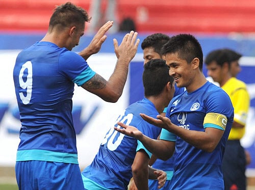 Robin Singh and Sunil Chhetri of India celebrate the goal against Pakistan under 23 side football match at the Bangalore Football Stadium on Sunday./PHOTO Kishor Kumar Bolar. DH