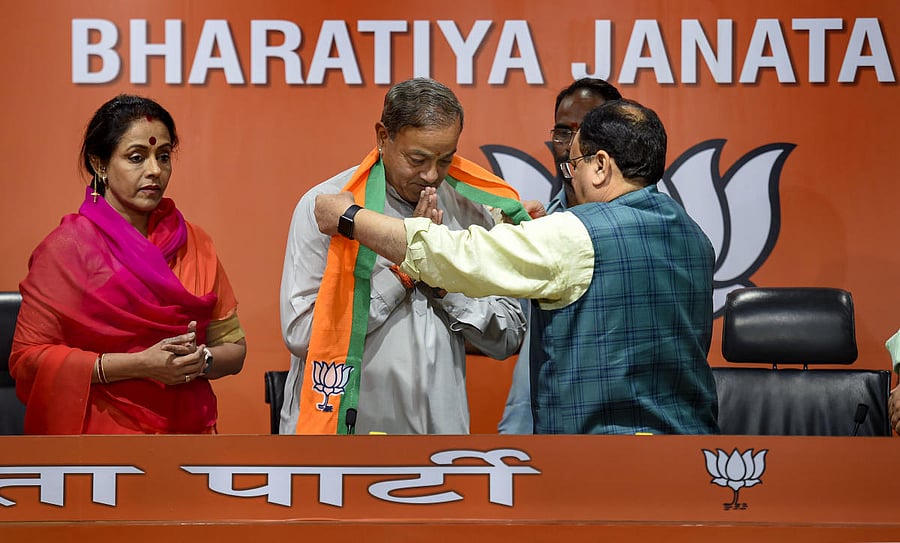 BJP Working President JP Nadda felicitates Sanjya Sinh, as he joins BJP along with his wife Ameeta Sinh, in New Delhi on Wednesday. (PTI Photo)