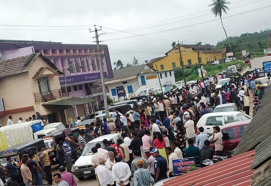 People wait on both sides of the road in Banakal to catch a glimpse of the mortal remains of Cafe Coffee Day founder V G Siddhartha Hegde.