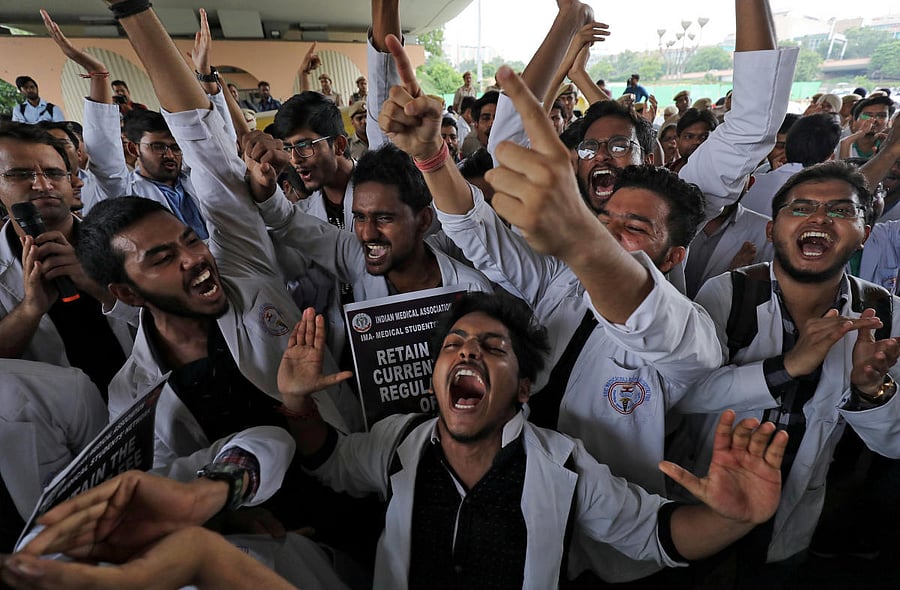 Medical students shout slogans during a protest against National Medical Commission (NMC) Bill, which they say will result in deterioration of medical studies and services, in New Delhi. Reuters photo