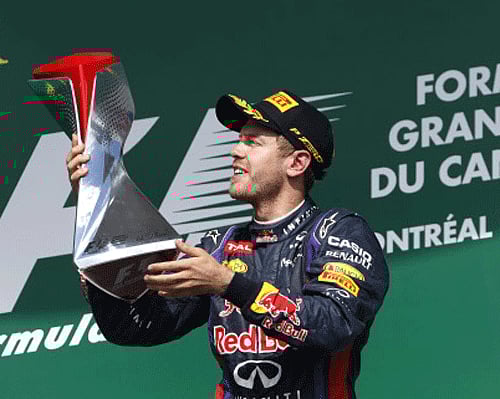 Red Bull driver Sebastian Vettel of Germany holds the trophy on the podium after winning the Formula One's Canadian Grand Prix, at the Gilles Villeneuve racetrack, in Montreal, Canada, Sunday, June 9, 2013. Ap Photo
