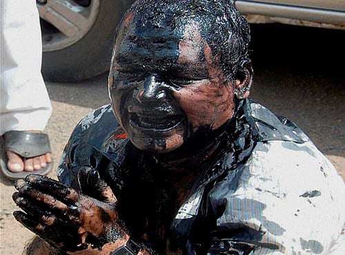 RTI activist, Mallikarjun Bhaikatti assaulted and his face blackened by Shiv Sena workers after he exposed an illegal construction case, at Latur, in Marathwada region. PTI file photo