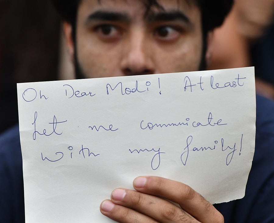 An activist takes part in a protest in Bangalore on August 5, 2019, in reaction to the Indian government scrapping Article 370 that granted a special status to Jammu and Kashmir. - The Indian government on August 5 stripped Kashmir of the special autonomy it has had for seven decades, prompting a furious response from nuclear-armed rival Pakistan and raising fears of further violence in the Muslim-majority Himalayan region. AFP