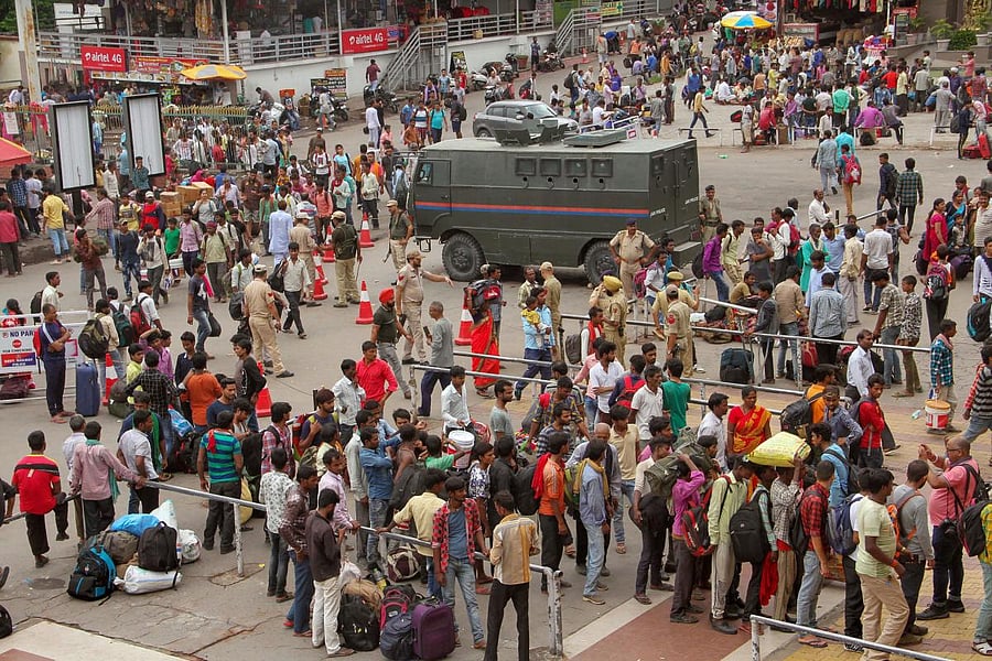 Jammu: Heavy rush of stranded passengers at a railway station during restrictions, in Jammu, Wednesday, Aug 07, 2019. Restrictions have been imposed in several districts of Jammu and Kashmir as the state lost its special status and was bifurcated on Tuesd