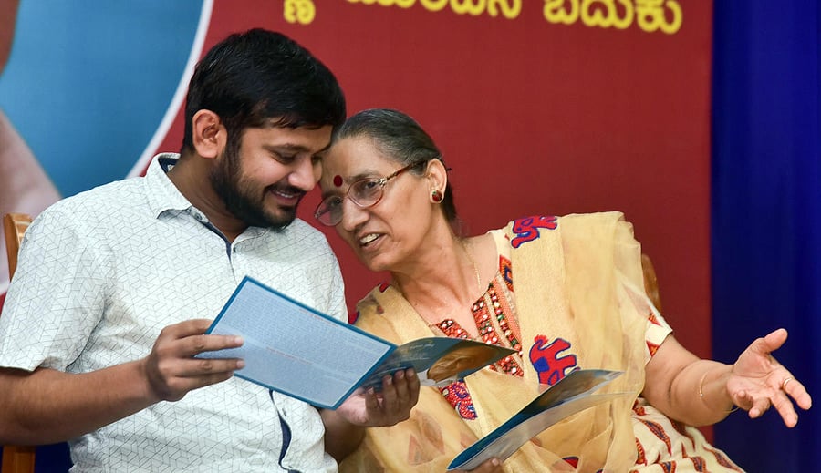 CPI leader Kanhaiya Kumar and AITUC General Secretary Amarjeet Kaur share a lighter moment during the centenary of B V Kakkilaya, in Mangaluru on Saturday.