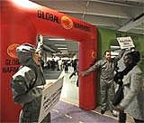 WWF activists cheer as a participant passes through a ''Global Warming gate'' on the opening day of the Climate Conference in Copenhagen on Monday. AP