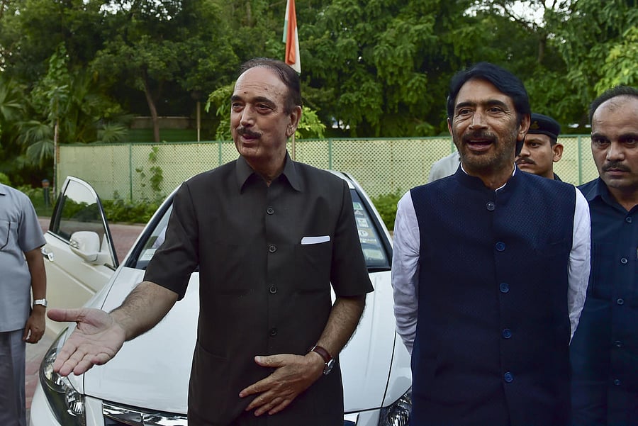 Senior Congress leader Ghulam Nabi Azad arrives at his residence, in New Delhi. Azad was stopped at the Srinagar airport and sent back by a flight. (PTI Photo)