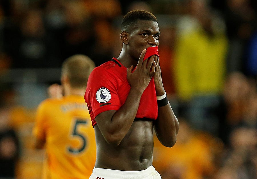 Pogba won the second-half penalty but failed to convert it as Rui Patricio dived to his left to make the stop, denying United a chance at victory (Reuters Photo)
