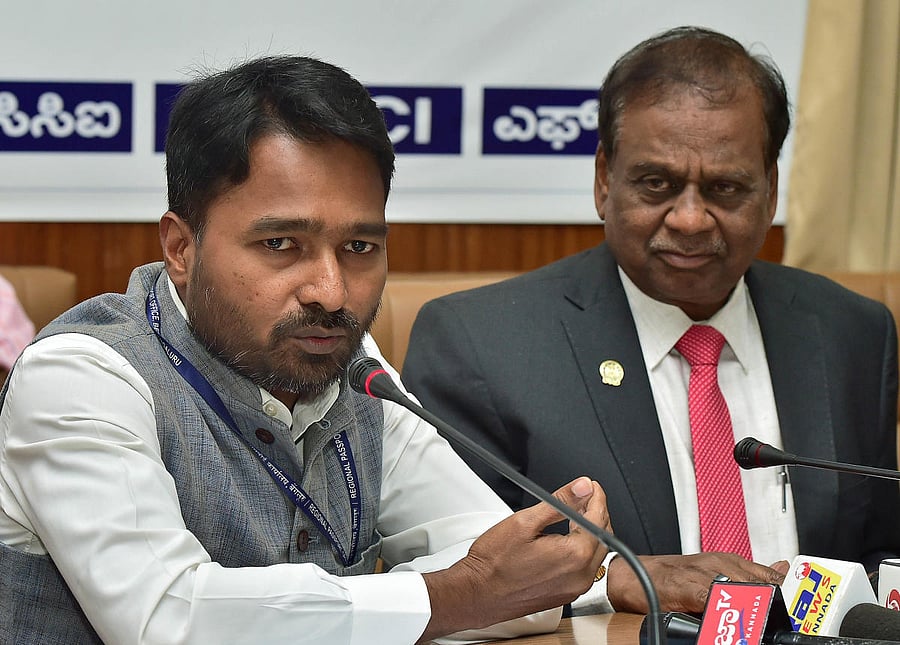 RPO Bharat Kumar Kuthati speaks at FKCCI on Wednesday. FKCCI president C R Janardhan looks on. dh PHOTO/ Ranju P