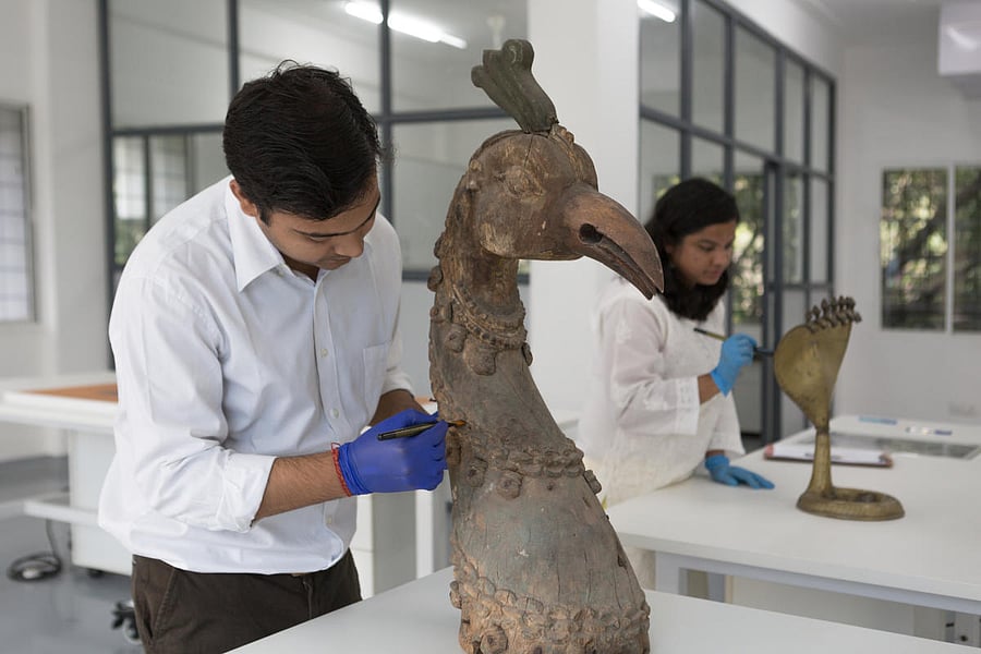Art conservators working on artwork.