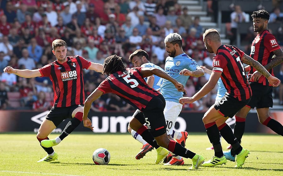Manchester City's Argentinian striker Sergio Aguero (C) scores his team's third goal during the English Premier League football match between Bournemouth. (AFP Photo)