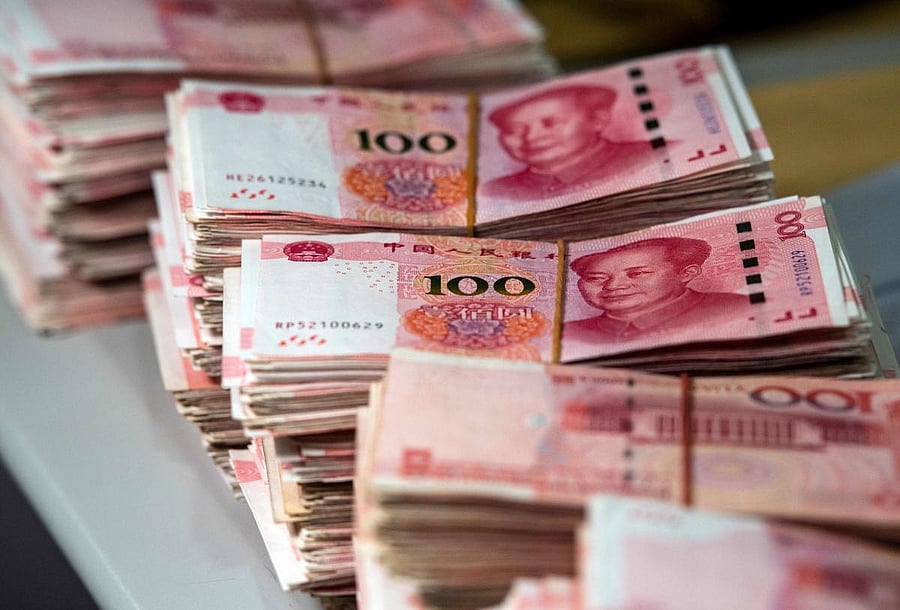 The onshore yuan fell to 7.1487 to the US dollar, its weakest point since early 2008, in Asian trading. AFP file photo