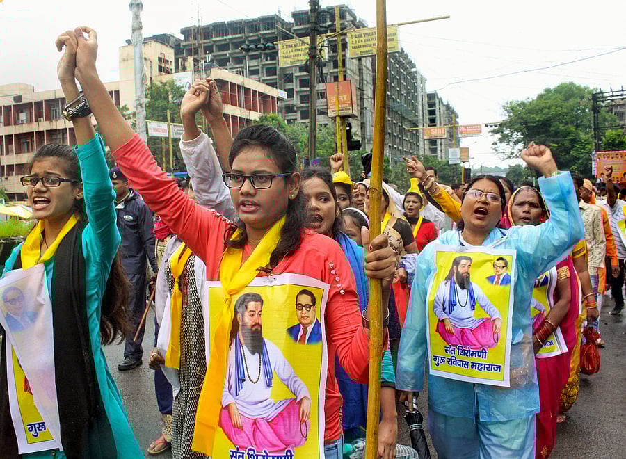 Members of Ahirwar Community take part in protest rally against the demolition of a Sant Ravidas temple in New Delhi. (PTI Photo)